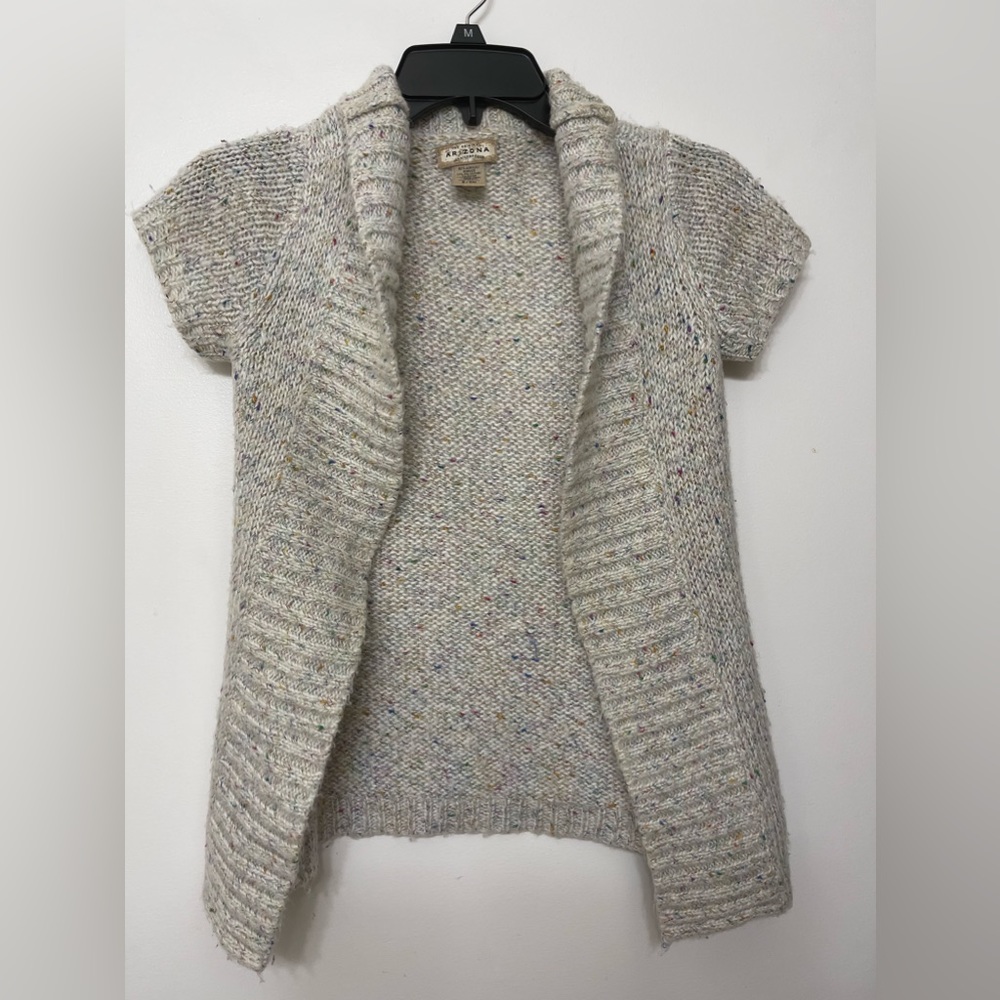 It is an Arizona shrug like sweater. It is size small and is like multi colored.